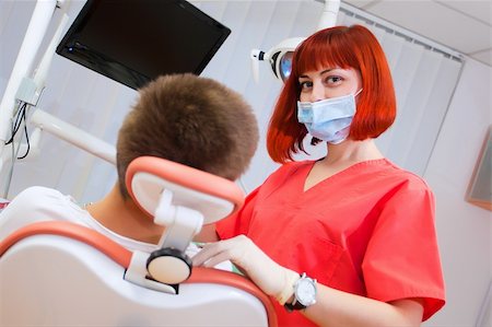 simsearch:400-04340930,k - Image of young lady with dentist over her checking oral cavity Foto de stock - Super Valor sin royalties y Suscripción, Código: 400-04308652