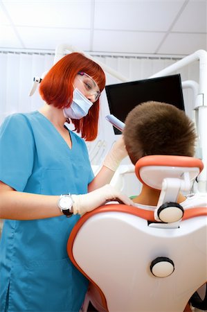 simsearch:400-04340930,k - Image of young lady with dentist over her checking oral cavity Foto de stock - Super Valor sin royalties y Suscripción, Código: 400-04308653