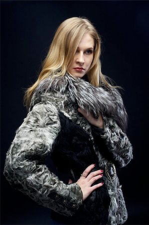 simsearch:400-05051542,k - beautiful woman in a fur coat at black background Stock Photo - Budget Royalty-Free & Subscription, Code: 400-04308709