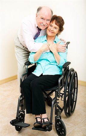 simsearch:400-04109826,k - Loving middle-aged husband and wife.  She is in a wheelchair. Fotografie stock - Microstock e Abbonamento, Codice: 400-04308913