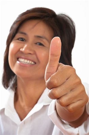 isolated portrait of a young, attractive and happy woman is smiling and shows the thumb Stock Photo - Budget Royalty-Free & Subscription, Code: 400-04308971