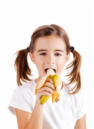 Portrait of a beautiful little girl eating a banana Photographie de stock - Aubaine LD & Abonnement, Code: 400-04309519