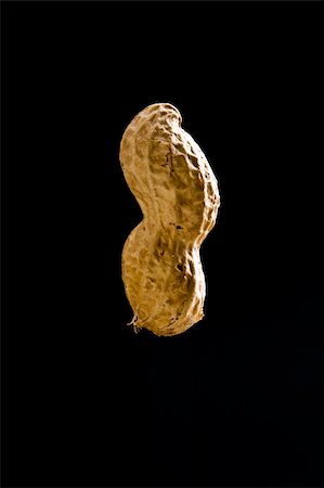 peanut object - Isolated closeup of peanut in shell on black background Stock Photo - Budget Royalty-Free & Subscription, Code: 400-04309602