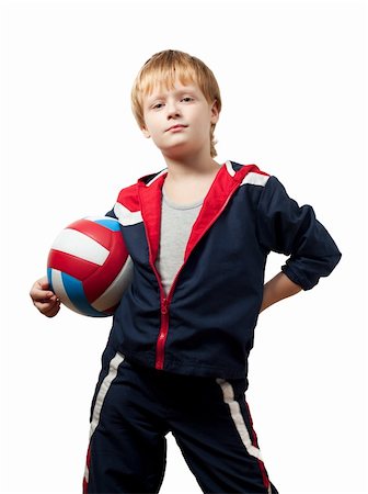 fun volley ball - The little boy in a jumpsuit holds a volleyball ball. Isolated Stock Photo - Budget Royalty-Free & Subscription, Code: 400-04309661