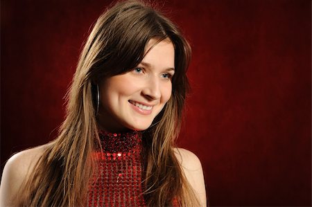 Portrait of the beautiful woman on a red background Stock Photo - Budget Royalty-Free & Subscription, Code: 400-04309939