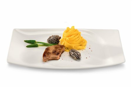simsearch:400-08115563,k - Tasty meat with noodles in a plate isolated on a white background. Photographie de stock - Aubaine LD & Abonnement, Code: 400-04300033