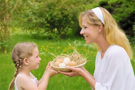 Mother and daughter holding fresh eggs Stock Photo - Budget Royalty-Free & Subscription, Code: 400-04300235