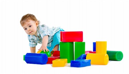 Cute little baby boy with colorful building blocks isolated on white Fotografie stock - Microstock e Abbonamento, Codice: 400-04300581