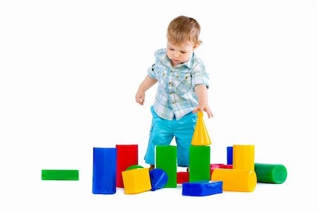 Cute little baby boy with colorful building blocks isolated on white Fotografie stock - Microstock e Abbonamento, Codice: 400-04300582