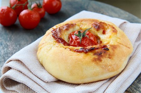 simsearch:400-08014878,k - Italian Focaccia bread with tomato and cheese on the board Stock Photo - Budget Royalty-Free & Subscription, Code: 400-04300777