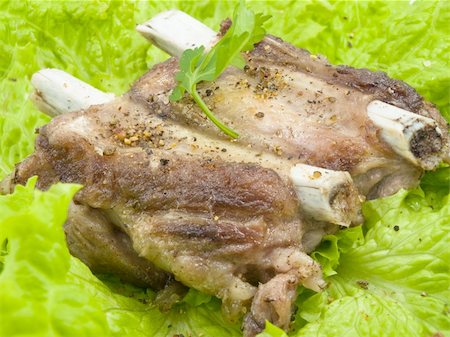 Well-done pork edges are located on leaves of salad and decorated by parsley greens Stockbilder - Microstock & Abonnement, Bildnummer: 400-04300832