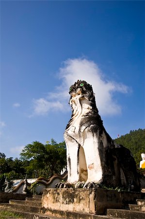 famous thailand sculptures - Thai lion statue,thai temple  In Thailand Stock Photo - Budget Royalty-Free & Subscription, Code: 400-04301392