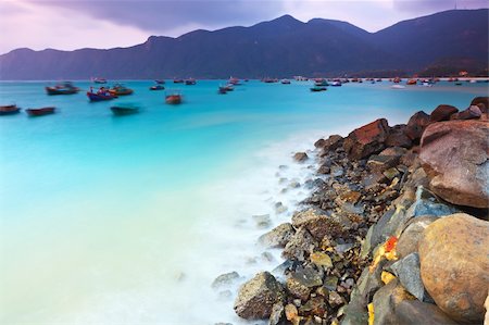 Sunrise over the sea. Stone on the foreground Stockbilder - Microstock & Abonnement, Bildnummer: 400-04301436