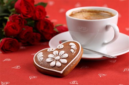Gingerbread heart with coffee and red roses on red background. Shallow dof Stock Photo - Budget Royalty-Free & Subscription, Code: 400-04301909