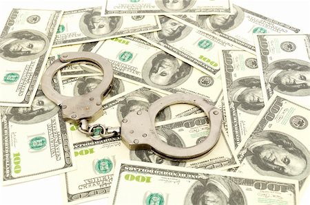 simsearch:640-02656413,k - Handcuffs on money background, business security concept Foto de stock - Super Valor sin royalties y Suscripción, Código: 400-04302437