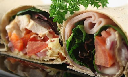 simsearch:400-04613511,k - Mixed platter of delicious ham and chicken salad wraps. Fotografie stock - Microstock e Abbonamento, Codice: 400-04302829