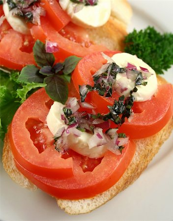 simsearch:400-05255035,k - Fresh and light roma tomato and bocconcini bites topped red onion and basil oil. Stock Photo - Budget Royalty-Free & Subscription, Code: 400-04302836