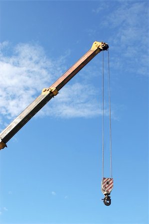 elevated sky - Crane with hook on blue sky background Stock Photo - Budget Royalty-Free & Subscription, Code: 400-04302939