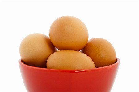 simsearch:400-04992703,k - brown eggs in red bowl on white background Stock Photo - Budget Royalty-Free & Subscription, Code: 400-04302962