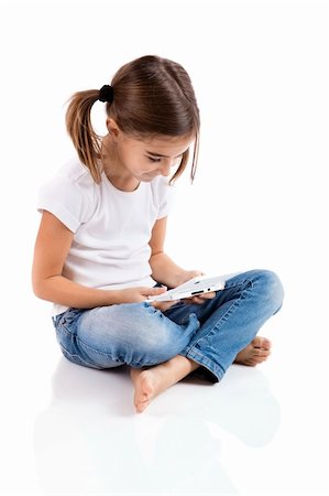 Little girl sitting on floor playing a video-game Stock Photo - Budget Royalty-Free & Subscription, Code: 400-04303398