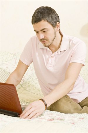 simsearch:400-03922148,k - Picture of young handsome man working online from his house on the laptop Foto de stock - Super Valor sin royalties y Suscripción, Código: 400-04314001