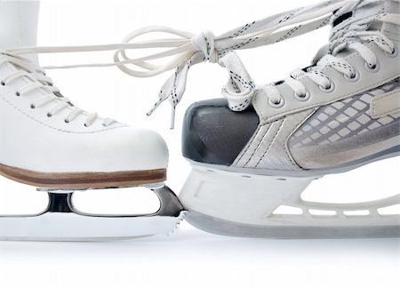 simsearch:614-03903615,k - Skate for figure skating and  hockey skate tied against each other close up isolated on white background Stockbilder - Microstock & Abonnement, Bildnummer: 400-04314891
