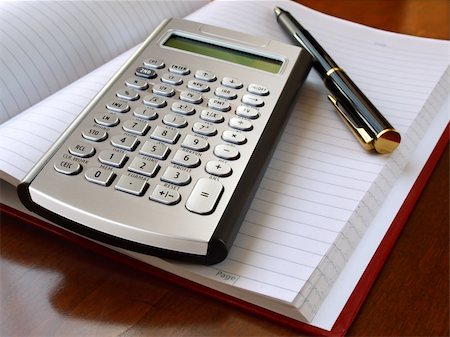 Planner with calculator and pen on the table Photographie de stock - Aubaine LD & Abonnement, Code: 400-04314993