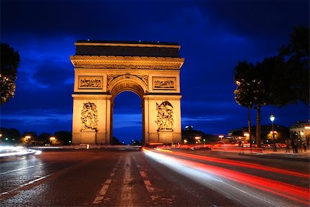 Beautifly lit Triumph Arch at night with light traces of passing cars. Paris, France. Stock Photo - Budget Royalty-Free & Subscription, Code: 400-04315162