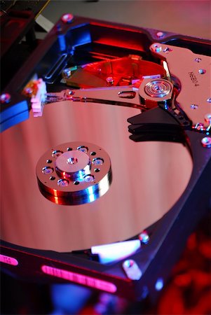 data recovery - Open hard disk close-up with electronics in the background Stock Photo - Budget Royalty-Free & Subscription, Code: 400-04315224