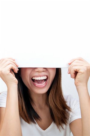 simsearch:400-04364119,k - Concept photo of Asian woman holding a white card, covering her eyes. Fotografie stock - Microstock e Abbonamento, Codice: 400-04315304