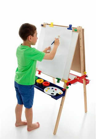 school boy in shorts - A little boy starting to paint a picture using acrylic paints and art paper on an easel.  White background. Stock Photo - Budget Royalty-Free & Subscription, Code: 400-04315331