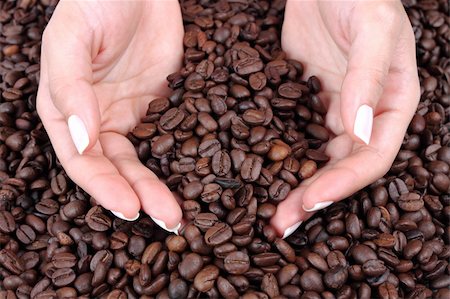 woman holding many coffee beans in his hand Stock Photo - Budget Royalty-Free & Subscription, Code: 400-04315499