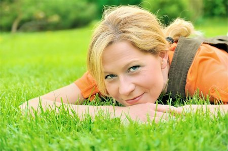 simsearch:400-05118067,k - Young woman relaxing on the grass Stock Photo - Budget Royalty-Free & Subscription, Code: 400-04315710