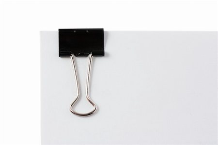 simsearch:400-04092083,k - Macro view of black paper clip isolated over white Foto de stock - Super Valor sin royalties y Suscripción, Código: 400-04315746