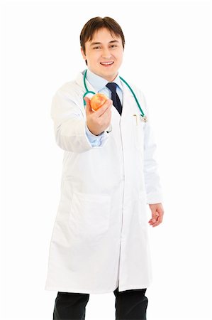 simsearch:400-04351236,k - Smiling  medical doctor holding apple isolated on white Photographie de stock - Aubaine LD & Abonnement, Code: 400-04316004