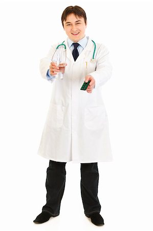 simsearch:695-05769743,k - Smiling  medical doctor holding pack of pills and glass of water in hands isolated on white Stock Photo - Budget Royalty-Free & Subscription, Code: 400-04316011