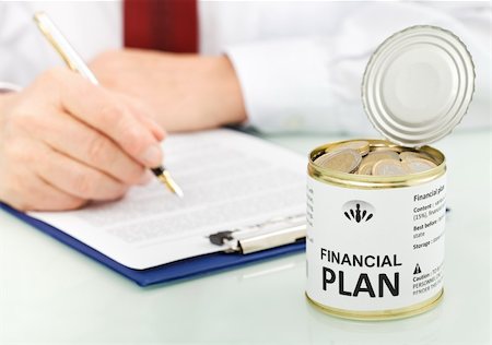 saving can - Closeup on business man hands making financial plan with an opened can of euro coins - concept Stock Photo - Budget Royalty-Free & Subscription, Code: 400-04316033