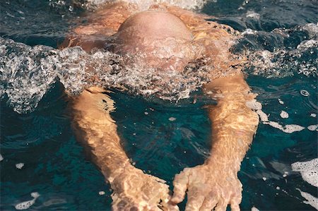 Detail of young man swimming Stock Photo - Budget Royalty-Free & Subscription, Code: 400-04316576
