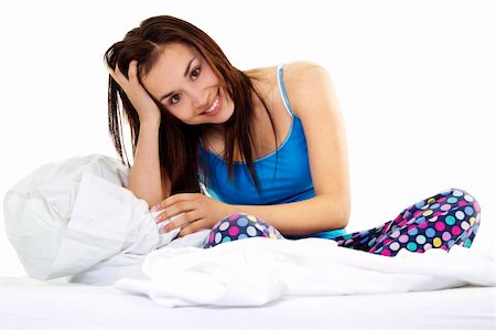 simsearch:400-04903640,k - Stock image of young woman in pajamas sitting on bed over white background Photographie de stock - Aubaine LD & Abonnement, Code: 400-04316738