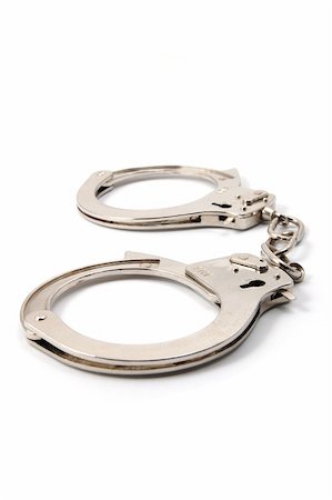 police handcuffs isolated on a white background Stock Photo - Budget Royalty-Free & Subscription, Code: 400-04316872