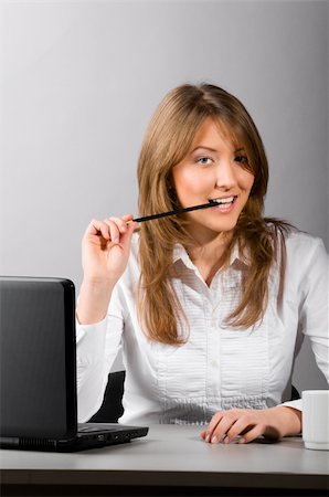 flirt women open mouth - business woman is sitting in the office with laptop Stock Photo - Budget Royalty-Free & Subscription, Code: 400-04316992