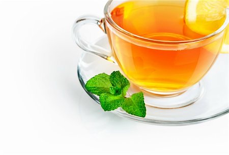 simsearch:6108-06907109,k - tea in cup with leaf mint and lemon isolated on white background Stockbilder - Microstock & Abonnement, Bildnummer: 400-04317209