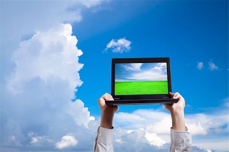 dramatic hands - computer in cloud Stock Photo - Budget Royalty-Free & Subscription, Code: 400-04317322