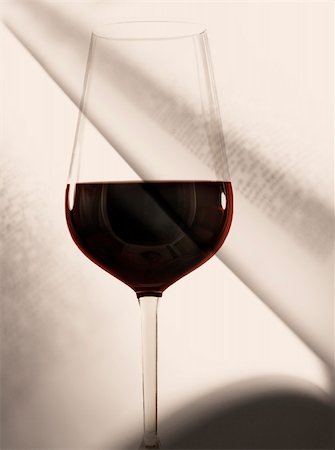 Glass of red wine in front of an open book Stock Photo - Budget Royalty-Free & Subscription, Code: 400-04317424