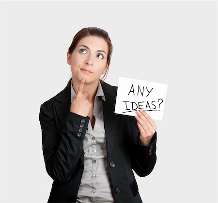 simsearch:400-04648812,k - Business woman holding a card board with the text message "Any Ideas" Stock Photo - Budget Royalty-Free & Subscription, Code: 400-04317617