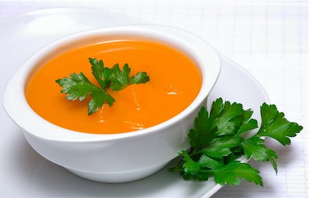 Pumpkin soup in white bowl  with parsley Photographie de stock - Aubaine LD & Abonnement, Code: 400-04318203