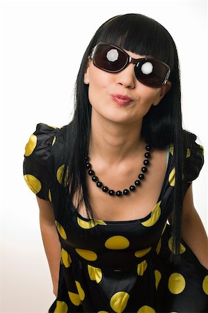 The glamour disco girl in sun glasses sends an air kiss Stock Photo - Budget Royalty-Free & Subscription, Code: 400-04318277