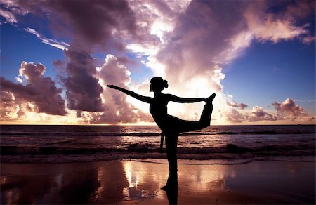 Yoga woman on the beautiful beach at sunrise Stock Photo - Budget Royalty-Free & Subscription, Code: 400-04318537