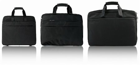 Three black laptop bags isolated on white background Stock Photo - Budget Royalty-Free & Subscription, Code: 400-04318611