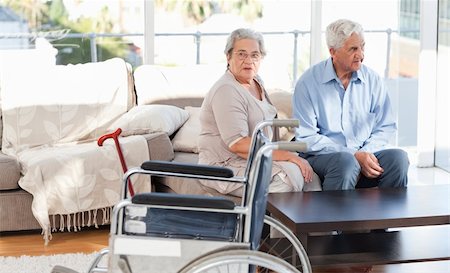 Lovely retired couple talking on the sofa Stock Photo - Budget Royalty-Free & Subscription, Code: 400-04318644